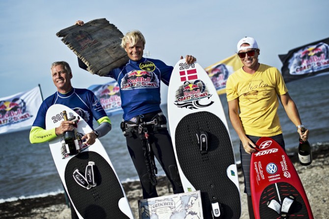 (L-R) Steffen Oeving from Danmark, Bjoern Rune Jensen from Danmark and Alex Caizergues from France seen at the award ceremony of the Red Bull Coast 2 Coast, the worlds longest kite surf race in history with more than 300 participants, at Niobe beach on the island Fehmarn, Germany on September 7 2013. Photo: Sebastian Marko / Red Bull Content Pool