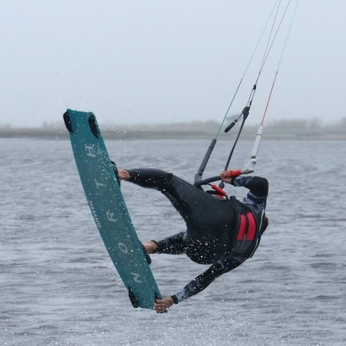 Pop Back Roll to Toeside with Front Hand Grab Kitesurfing Technique