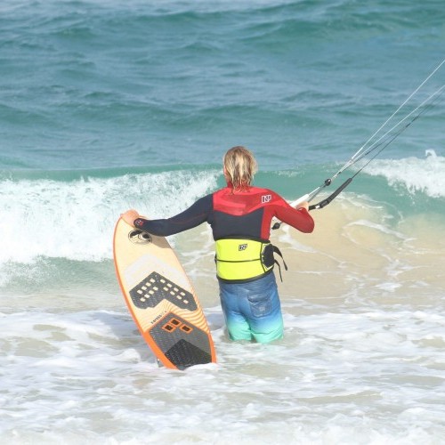 Body Dragging Past the Shorebreak on a Surfboard Kitesurfing Technique