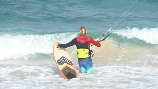 Kitesurfing Technique - Body Dragging Past the Shorebreak on a Surfboard
