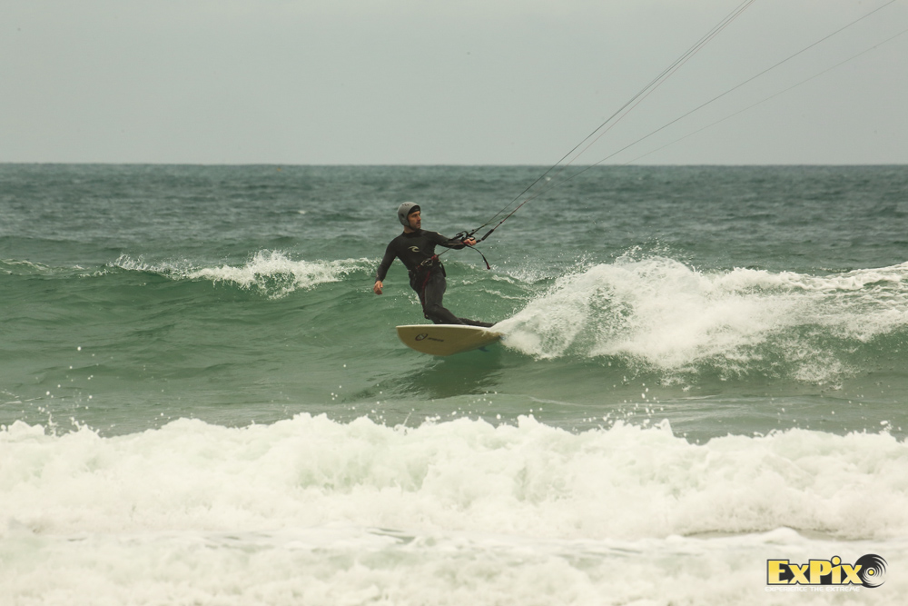 Chris Harmer from the senior fleet sets up for a solid wave.