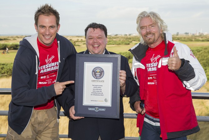 Snow-Camp director Dan Charlish with Guinnes World Record's Craig Glenday and Sir Richard Branson.