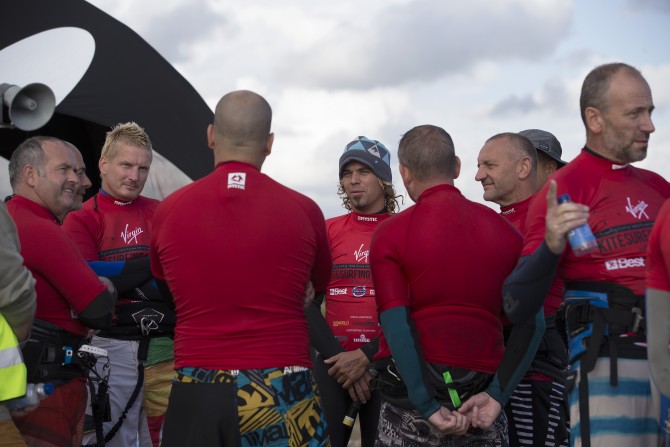 Lewis Crathern talking to other riders while they wait for wind - Ocean Images