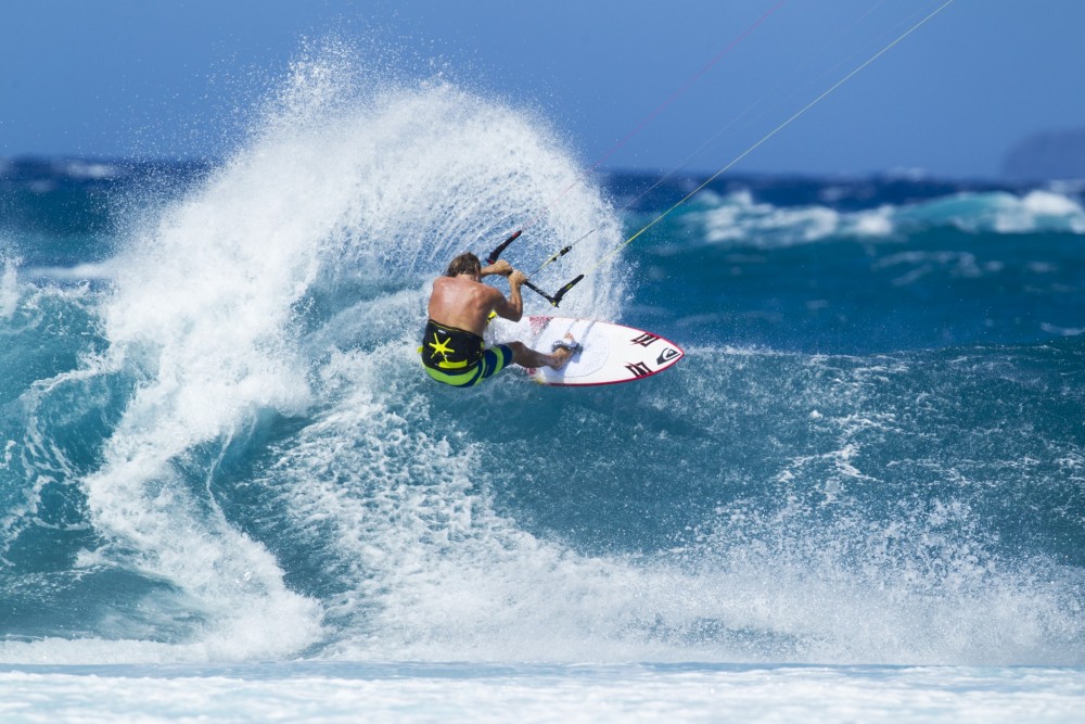Robby Naish throwing buckets on the Naish Global surfboard.