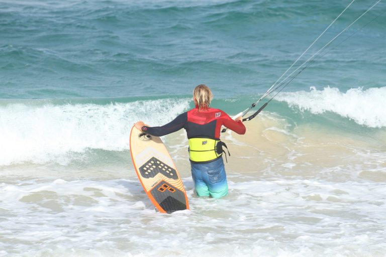 Kitesurfing Technique - Body Dragging Past the Shorebreak on a Surfboard